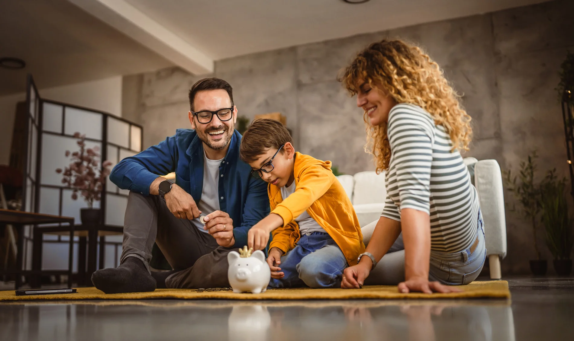 Family saving money in modern home